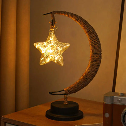 Glass star night light on wooden shelf with seasonal decorations