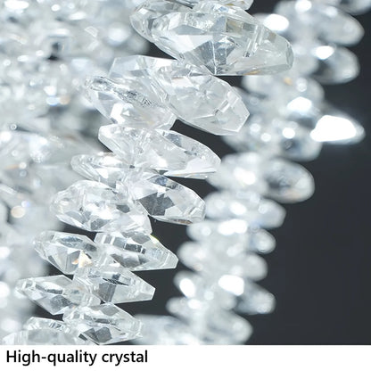 Clear crystal branches catching light along their length in gold