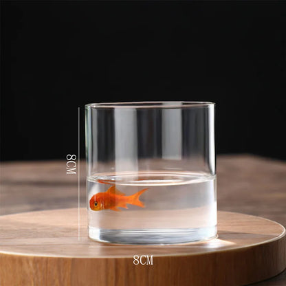 Transparent glass tube vase with single stem flower display