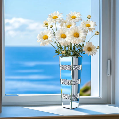 Mirrored silver floor vase with white calla lily arrangement in luxury room