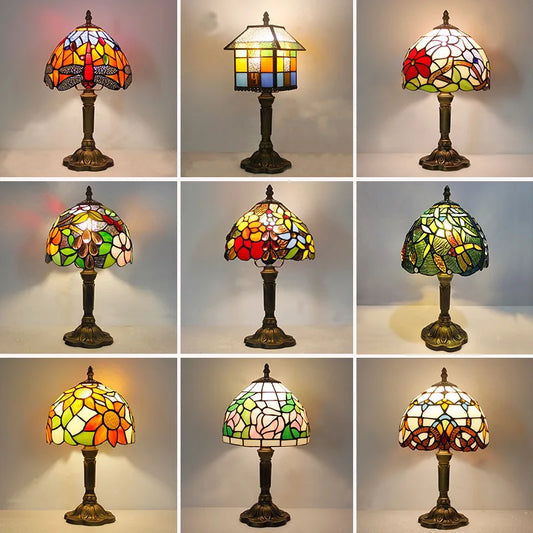 European Tiffany stained glass table lamp illuminated with jewel-tone light overhead view