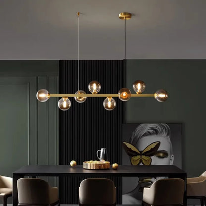 Ten head glass chandelier, 48 inches long, over a kitchen counter