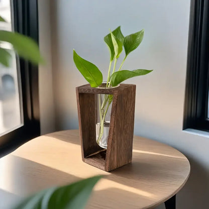 Side view of wooden propagation vase with small rooted plant in water