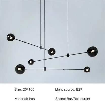 Industrial iron chandelier with round stained glass globes in a row