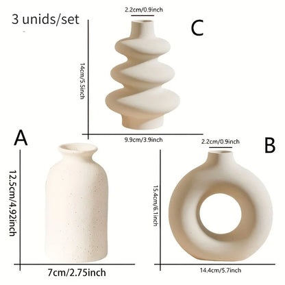 Side profile of three bohemian ceramic vases in contrasting white and black