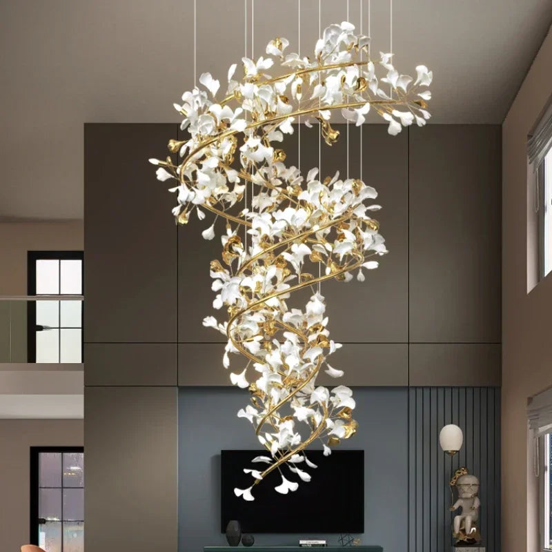 Ceramic leaf shade detail on a ginkgo chandelier lit from behind