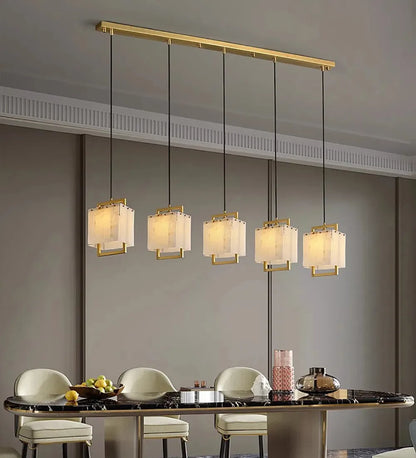 Four light natural marble chandelier in a gold polished finish