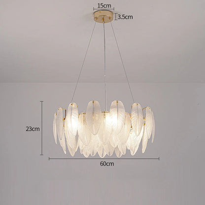 Matching feather glass wall lamp in a plated gold metal finish