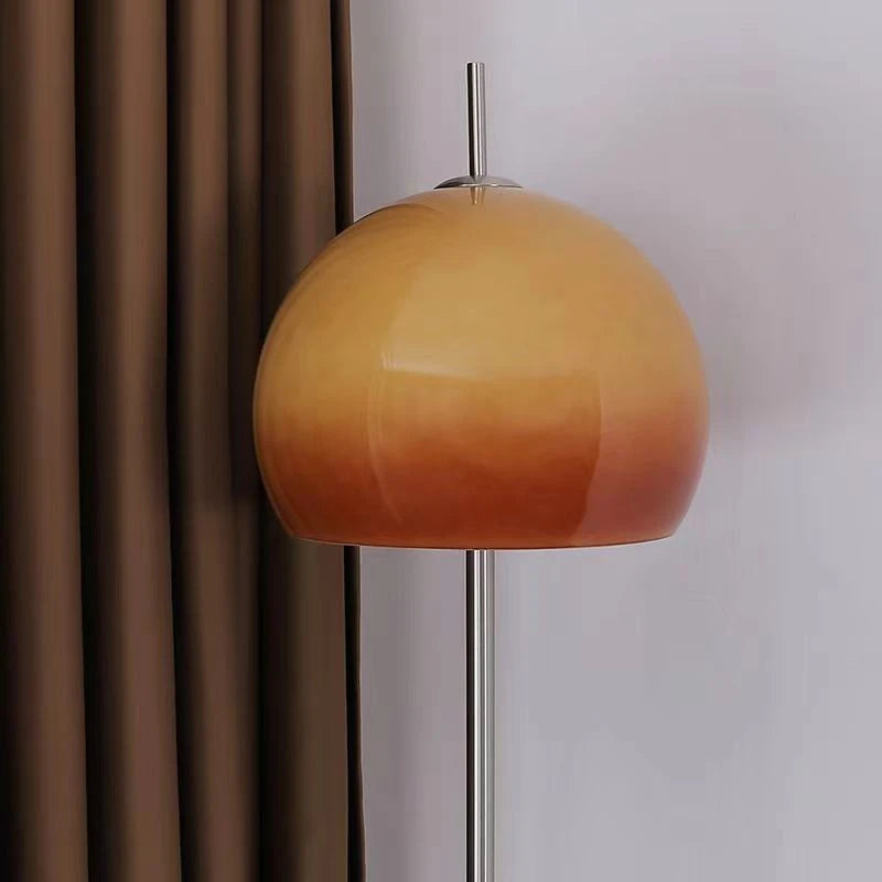 Orange glass shade close-up showing warm amber glow and glass texture