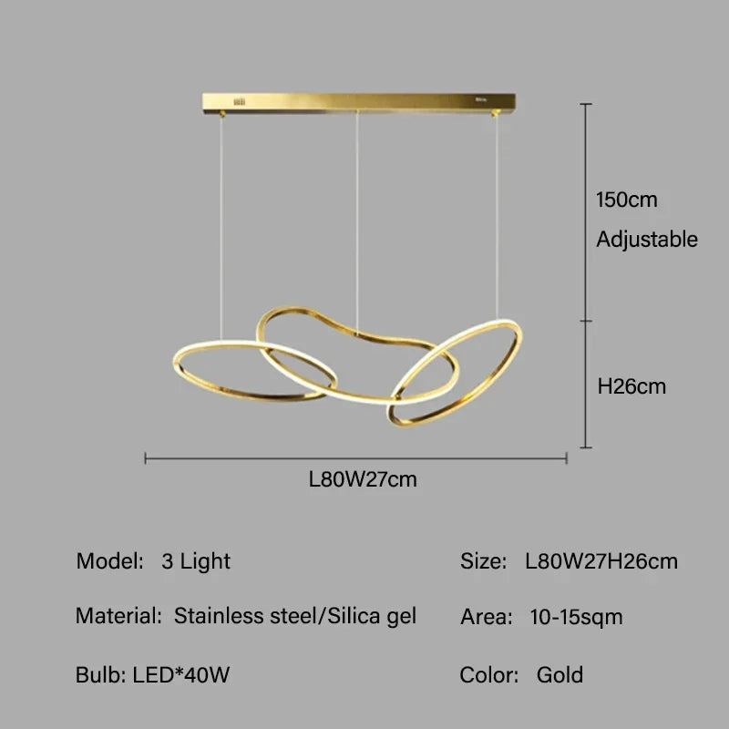 Gold circle chandelier set to warm light over a dining surface