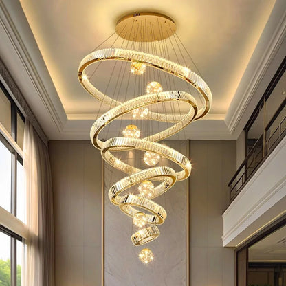 Crystal ring chandelier lit in warm white light down a stairwell