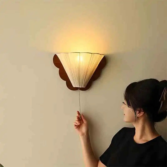 fabric shade wall sconce, front view on white background