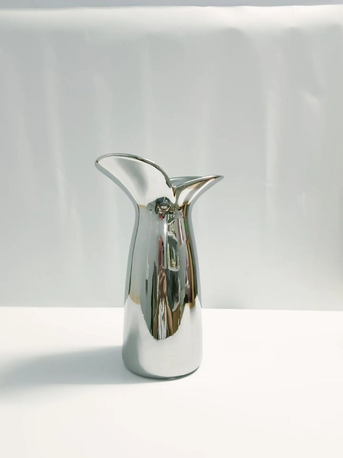 Side profile of electroplated wabi-sabi Nordic vase showing organic irregular sculptural form