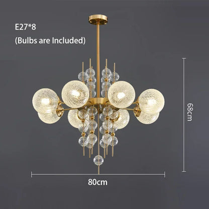 Matte glass bubble chandelier lit in white light on a copper frame