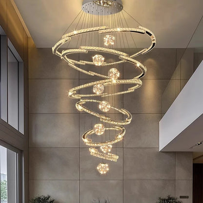 Cold white light across the crystal rings of a tiered chandelier