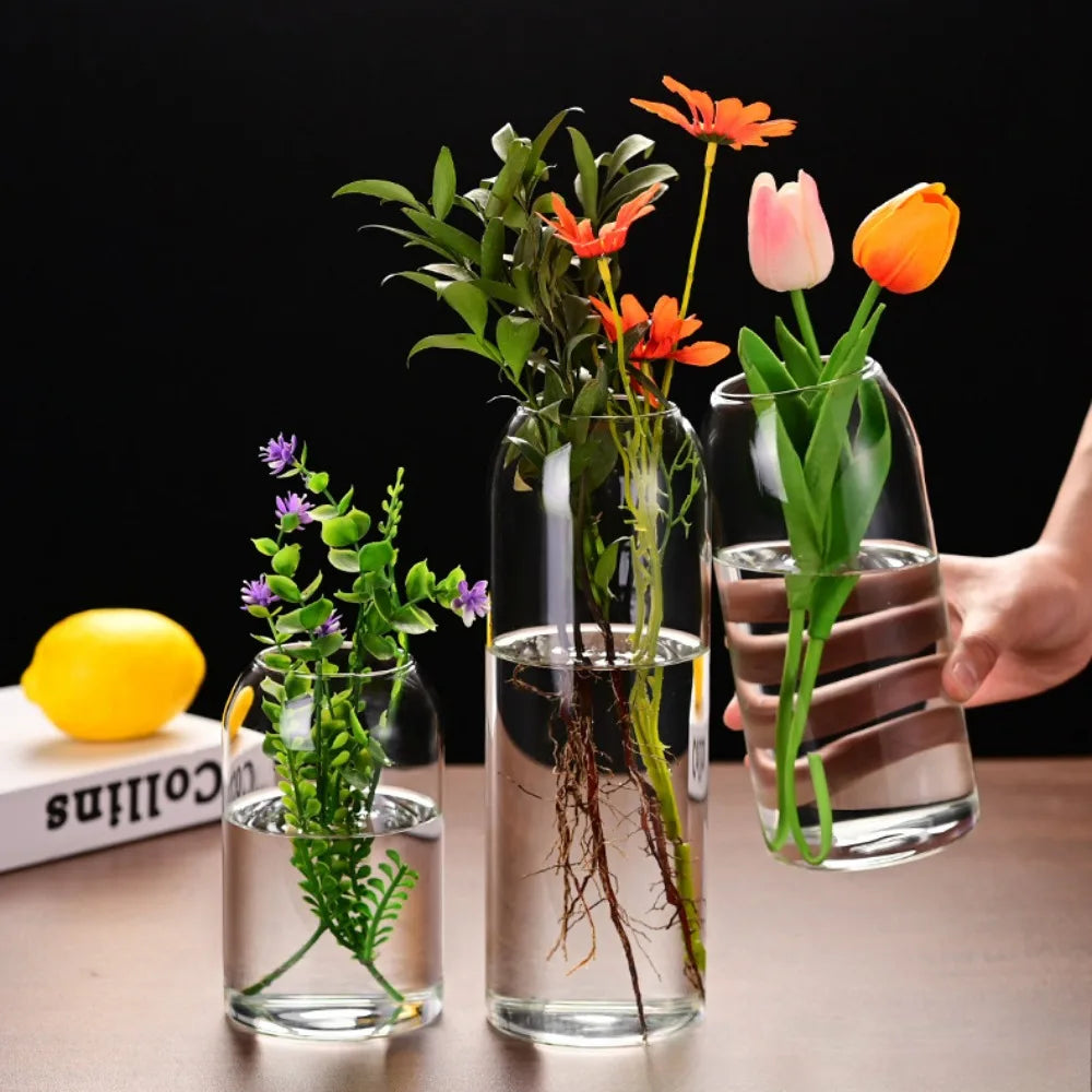 Modern glass vase holding white flower stem on Scandinavian styled shelf