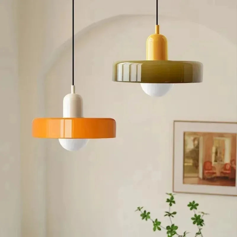 Pink glass chandelier shade on a plain iron pendant fitting