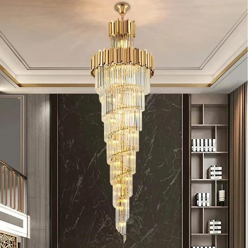 Multi layer crystal chandelier lit in warm light down a tall space