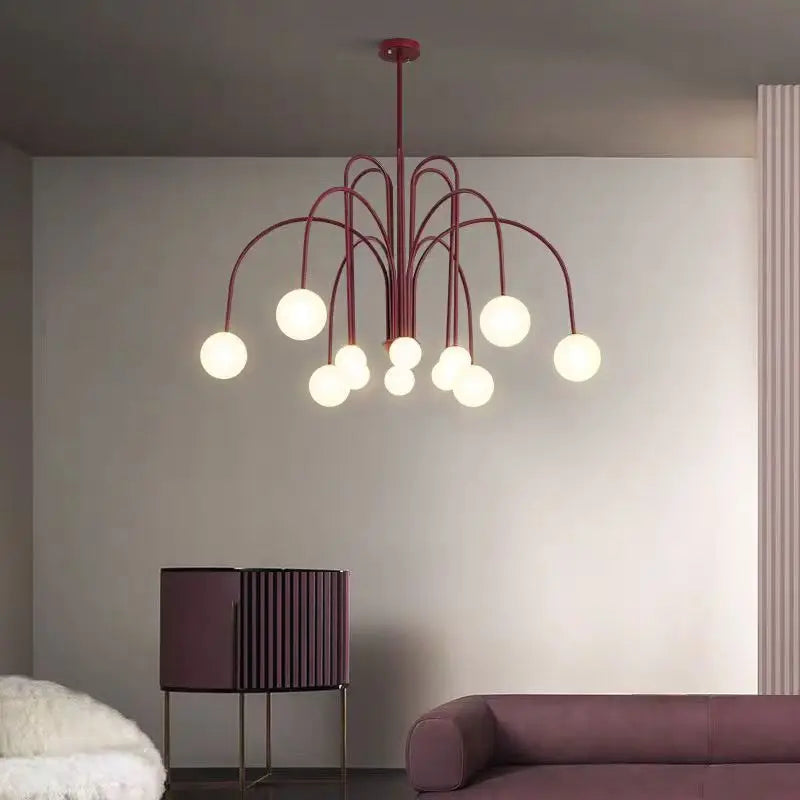 Arched glass globe chandelier with frosted globes on a curved iron arm