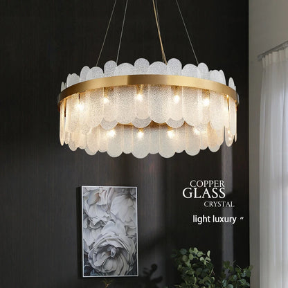 Gold ring glass chandelier with frosted glass set into an iron band