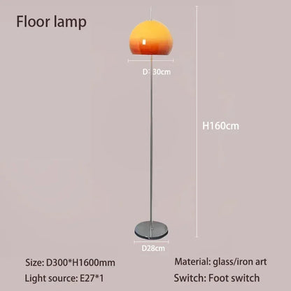Retro orange floor lamp switched on casting warm ambient glow in room