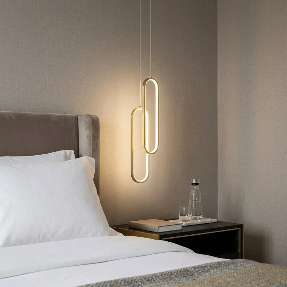 Slim acrylic tube chandelier in gold on an adjustable pendant cord