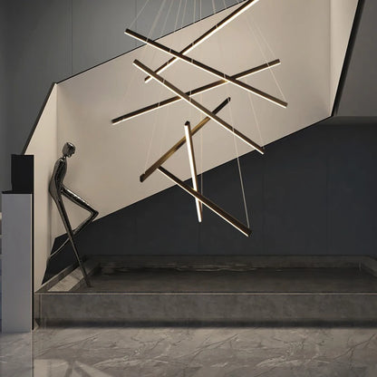 White Nordic chandelier with staggered pendant drops for a tall stairwell