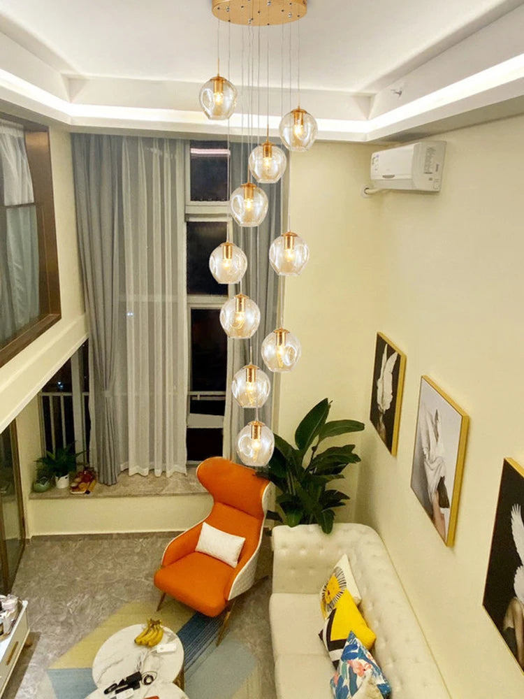 Thirty six globe chandelier with a 236.2 in drop for a tall stairwell
