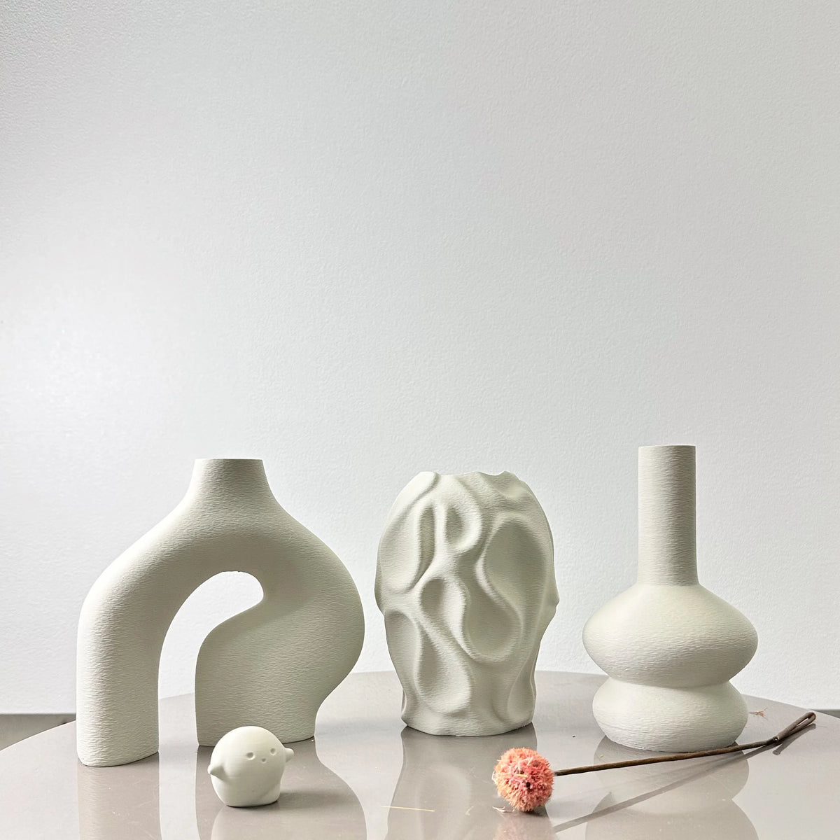 Scandinavian vase set with round shapes styled in living room