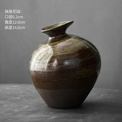 Style M abstract terracotta vase on bedside table with dried flowers