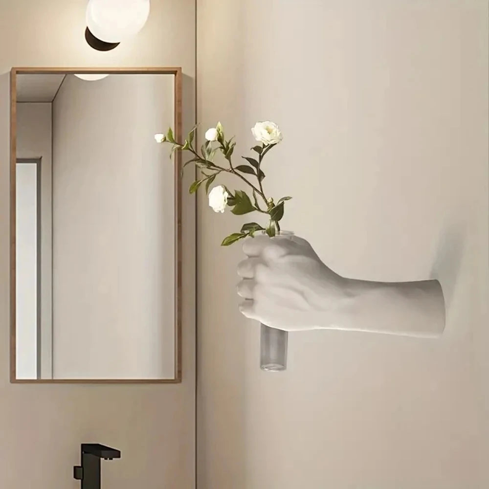 Boxer fist resin wall vase in punching pose with dried floral stem inside