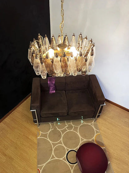 Grey glass chandelier on a polished stainless steel frame, semi flush mount