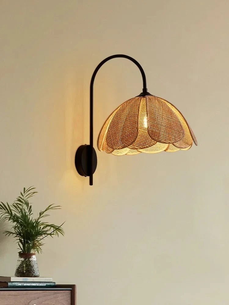 rattan wall sconce, detail view of fixture base and arm