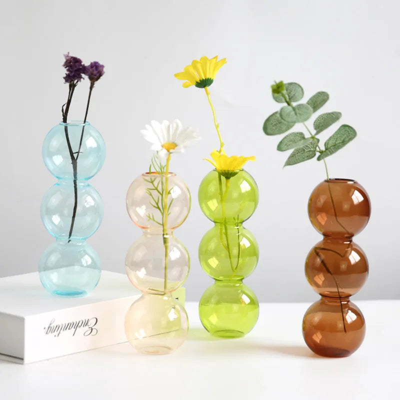 Orange Nordic glass terrarium vase pair in L and S sizes displayed together on shelf