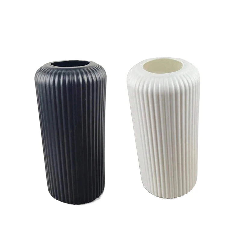Striped plastic vase with fresh flowers on contemporary home shelf