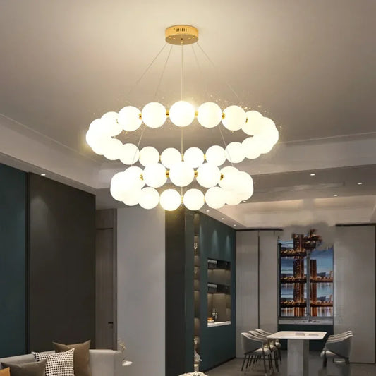 Pearl bead ring chandelier with white beaded strands on an iron frame