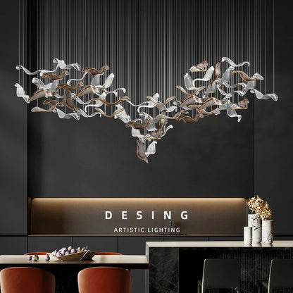 Linear glass pendant chandelier with shades on a plated metal bar