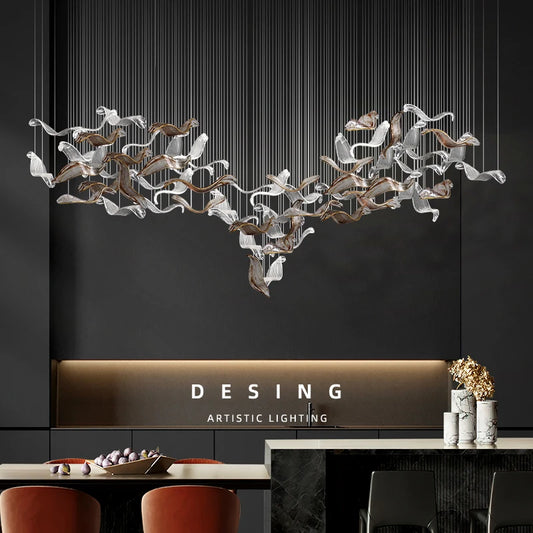 Linear glass pendant chandelier with shades on a plated metal bar