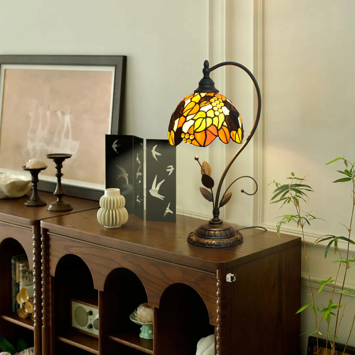Monstera leaf stained glass lamp switched on green tropical hue