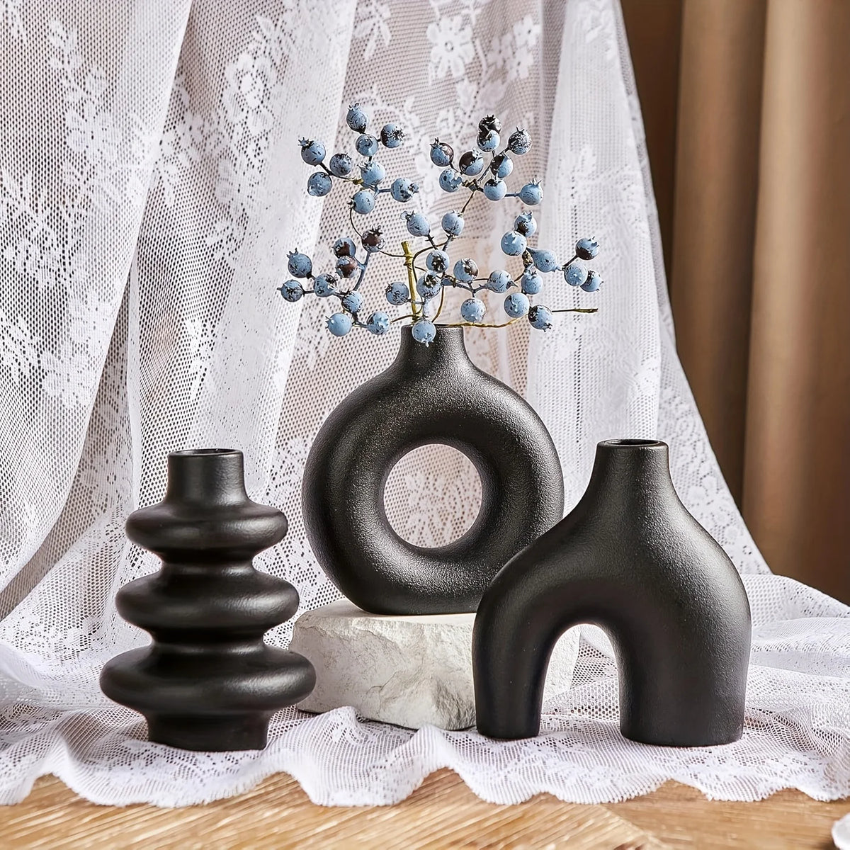 White matte ceramic vase from decorative set styled with dried pampas on console