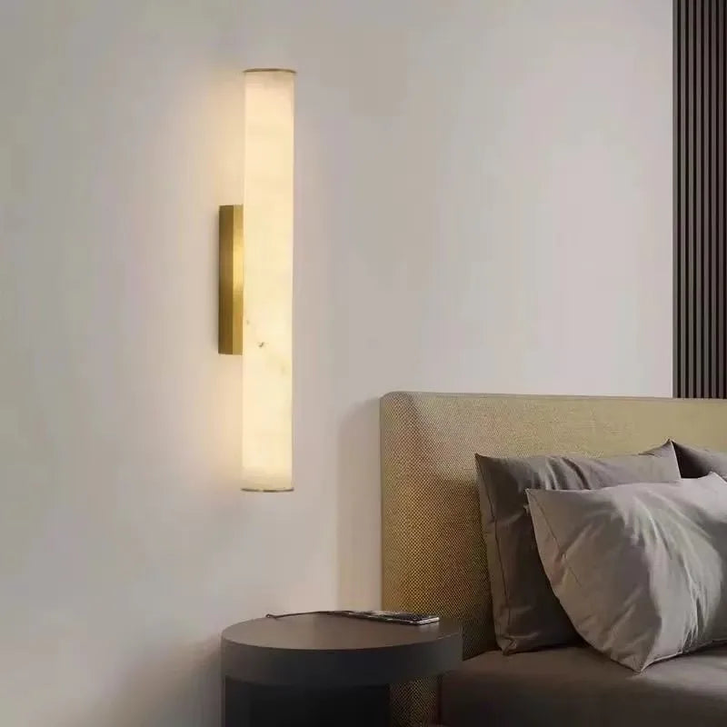black marble wall sconce, installed in a room interior setting