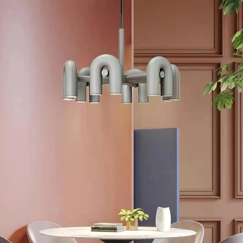 Six light U bent tube chandelier with orange painted tube ends