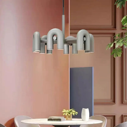 Six light U bent tube chandelier with orange painted tube ends