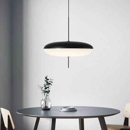 Acrylic shade chandelier diffusing warm 3000K light into a soft glow
