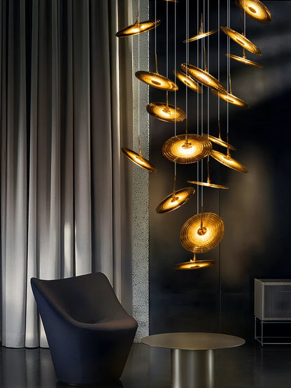 Blown glass staircase chandelier on a plated metal canopy