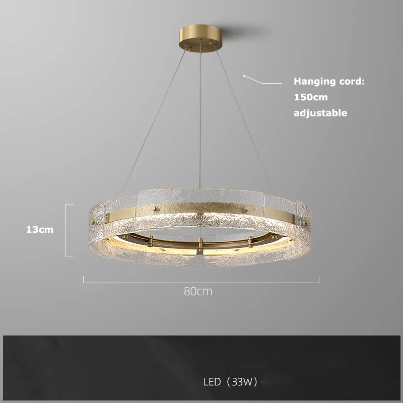 Rippled glass chandelier shown lit in warm white E14 LED light
