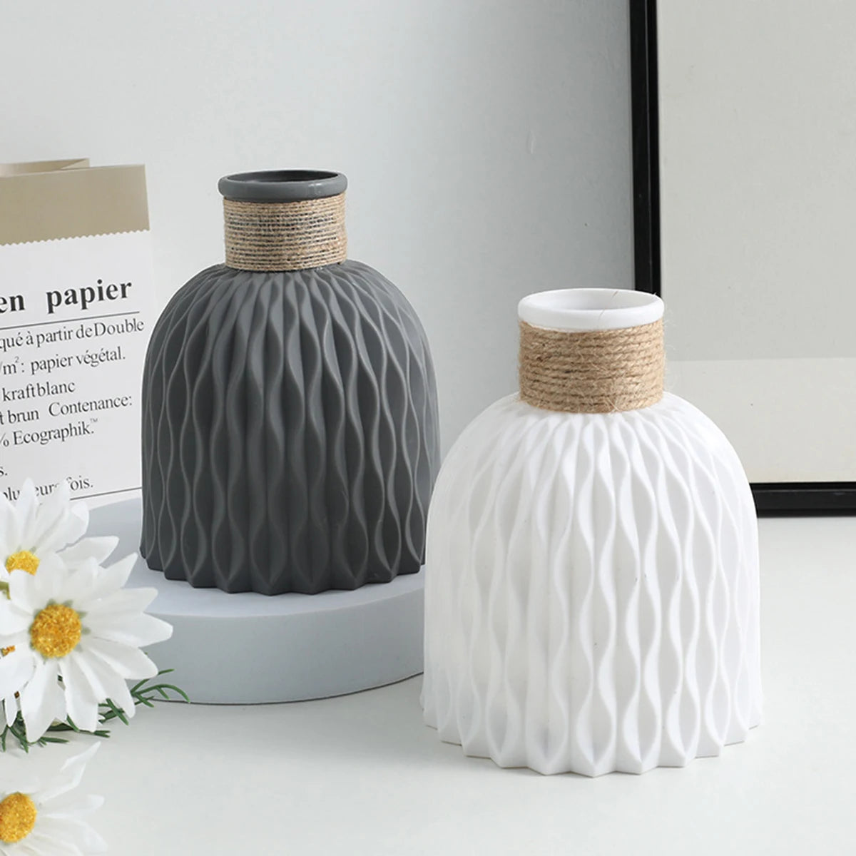 Beige plastic vase with wave ripple surface texture in Nordic minimalist style
