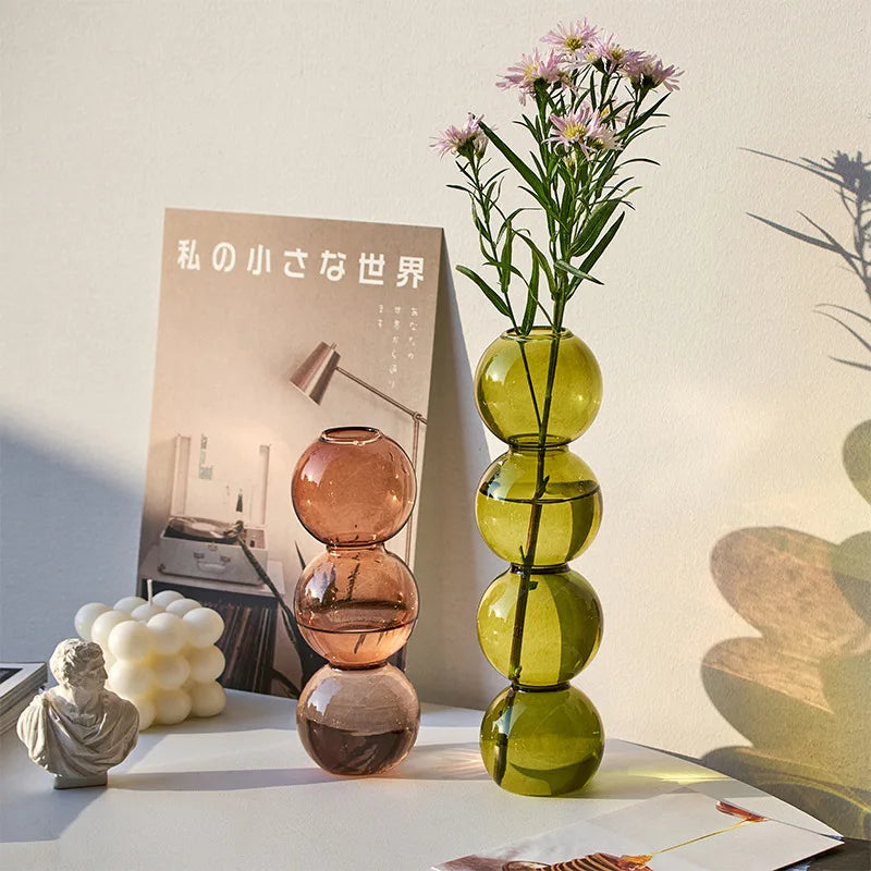 Champagne-L Nordic glass terrarium vase in neutral tone holding eucalyptus stems