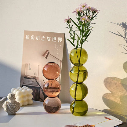 Champagne-L Nordic glass terrarium vase in neutral tone holding eucalyptus stems