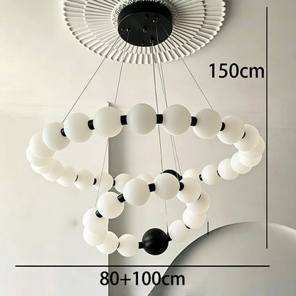 Two ring chandelier, 31.5 and 39.4 in across, in a gold finish